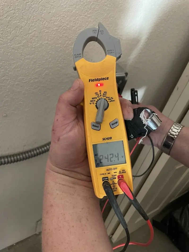 Voltage testing with clamp meter during Outlet Installation in Glassmanor